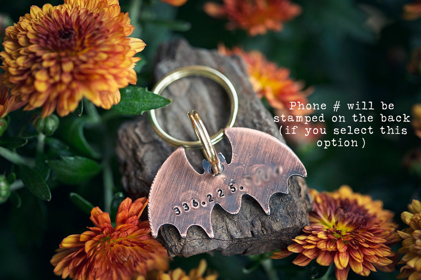 This is a bat-shaped dog or cat ID tag. It is made of copper and hand-stamped with your pet's name on the front and an optional phone number on the back.